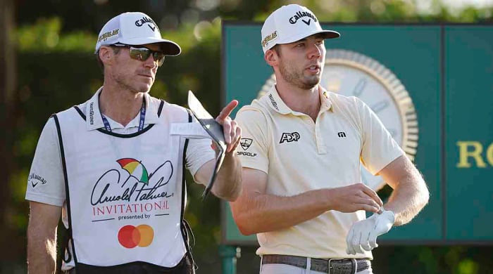 Sam Burns talks with caddie Travis Perkins during the 2022 Arnold Palmer Invitational Bay Hill Club in Orlando, Fla.